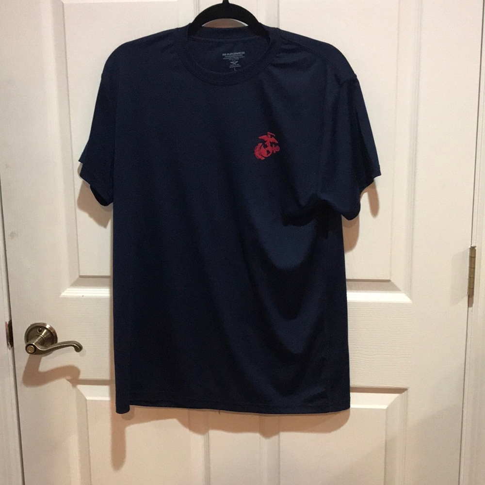 A deep blue Marines shirt that is 100% polyester.